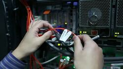 Administrator working in computer server room data center Stock Footage