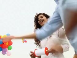 Low angle view of young couple flying kite, Delhi, India Stock Footage