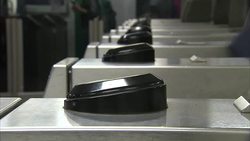 Commuters Swiping Through Ticket Barriers News Clip