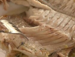 Eating a fish Stock Footage