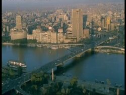 T/L Egypt, Cairo City and Bridge over River (from Cairo tower) - high angle view of city across road bridge, traffic, sunny, hazy air Stock Footage