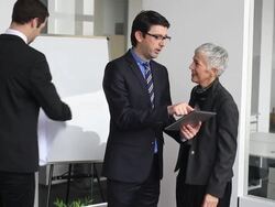 Team of architects going over blueprints Stock Footage