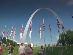 WS View of gateway arch shot through flags / St Louis, Missouri, United States Stock Footage
