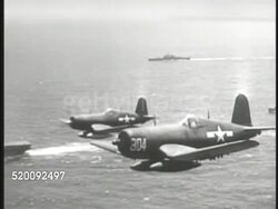 1945: PACIFIC THEATER of OPERATIONS: AERIAL Two F4U Corsair fighter aircraft in flight, USN 5th Fleet, aircraft carrier in water BG. Pacific Campaign, Front, WWII, World War II. Instructional Video