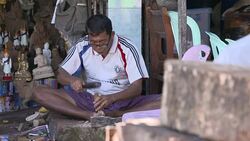 Craftsman making statues outside Shwedagon Pagoda News Clip