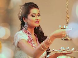 Young woman burning oil lamp in diwali festival  Stock Footage