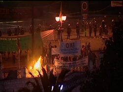 Greece fended off a bankruptcy that threatened to roil global financial markets, approving severe spending cuts and tax increases Wednesday in the face of violent protests by Greeks who say they have suffered enough. News Clip