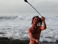 MS TS Rasta man spinninig poi balls with ocean / Montezuma, Punteranes, Costa Rica Stock Footage