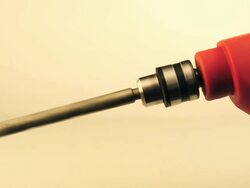 spining bit in hand drill white background Stock Footage