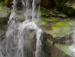 ECU Detail of Hoopii Falls and moss covered rocks / Kapaa, Kauai, Hawaii, United States Stock Footage