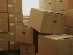 Storage room with heap of pasteboard boxes Stock Footage