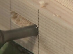 CU Drilling hold into piece of wood/ Slovenia Stock Footage