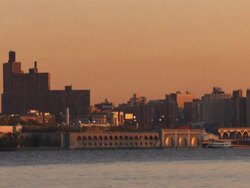 Golden light glows over a waste water treatment facility in New York City. Stock Footage
