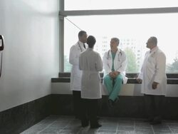 WS Four physicians in informal meeting at hospital corridor / Seattle, Washington, USA Stock Footage