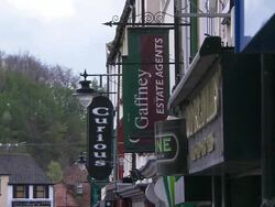 Shop signs in Armagh, Thomas street, Northern Ireland Stock Footage