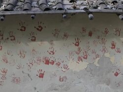 MS Painted handprints on side of house / India Stock Footage