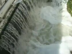 Treated Waste Water Flows from Chlorination Basin to Culvert Stock Footage