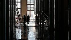 Workers walk through fermentation room at Septima winery. Stock Footage