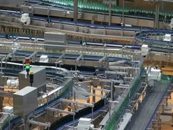 MS Shot of bottle moving in bottling plant at beverage industry / Gerolstein, Rhineland Palatinate, Germany  Stock Footage