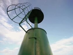 DOLLY: Lighthouse in the harbor Stock Footage