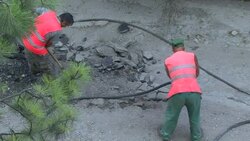 Road Workers using Jackhammer Stock Footage