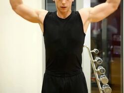 Man doing  exercise with weights at gym Stock Footage