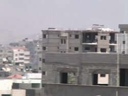 Smoke and explosions over buildings in Gaza News Clip