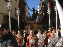 Statue of Jesus Christ being carried by Costaleros bearing a Trono a religious procession through the streets of Malaga, Spain, Europe Stock Footage