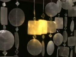 Golden mother of pearl curtain decoration close-up Stock Footage