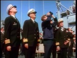 1960s John Kennedy with binoculars + naval officers looking up watching missiles / newsreel Stock Footage