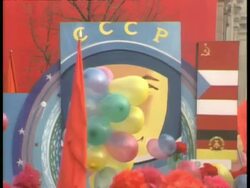 CU Large poster of cosmonaut moving right, balloons in foreground, Moscow Stock Footage