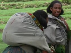 Afar women carrying loads on their backs Stock Footage