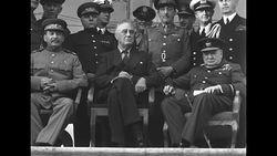 Churchill, Roosevelt, and Stalin sitting for photo opportunity at Tehran Conference during World War II News Clip