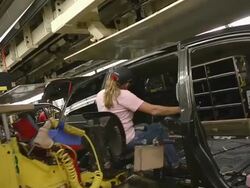 MS PAN Worker using an ergonomically designed sled to help her move inside mini van / Princeton, Indiana, United States Stock Footage
