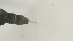 drilling into wall Stock Footage