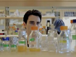 CU PAN Male lab technician looking for bottle sample at Cancer research  Healthcare medicine Industry DNA sequencing Laboratory / Vancouver, BC, Canada    Stock Footage