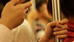 Crowded people in the mass public transportation using their phone Stock Footage