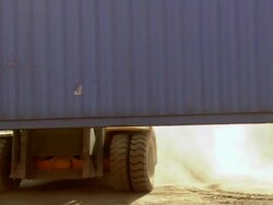 MS TS bulldozer lifting bleu container and moving / Los Angeles, California, United States Stock Footage