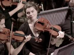 Front desk violinists in symphony orchestra Stock Footage