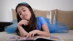 Girl reading book Stock Footage