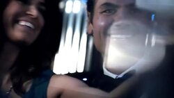 Classy couple take pictures with smartphone in limousine at awards show Stock Footage
