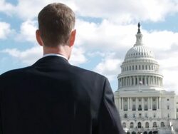 MS Man holding rolled Declaration of Independence in front of US Capitol Building / Washington, DC, USA Stock Footage
