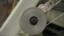 Plastic trimming line is fed through a spool. Stock Footage