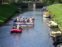 WS HA View of people enjoying their boat ferry from canal, North Sea North Frisia / Friedrichstadt, Schleswig Holstein, Germany Stock Footage