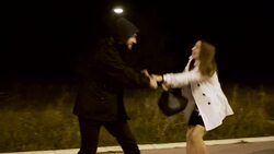 Robber stealing businesswoman bag in the street Stock Footage