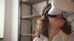 Young adult woman and a virtual reality headset. Girl using vr glasses Stock Footage