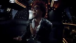 Hip-hop star dances and sings in back of limousine while fans pound on windows at awards show Stock Footage