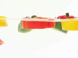 red, yellow and green pepper slice Splashing Stock Footage