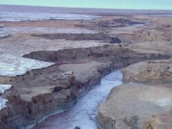 AERIAL WS TS View of muddy surface of dead sea in desert / Sourn Judea Desert, Israel  Stock Footage