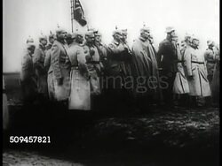 1914: WORLD WAR I: GERMAN INFANTRY: WS German soldiers marching. WS German officers standing. WS Troops marching. WS Officials, troops standing on field BG. WWI, invading Belgium Instructional Video